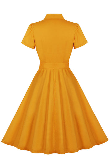 Vestido amarillo con volantes con muescas con solapa con lazos con cinturón de la década de 1950 con bolsillos